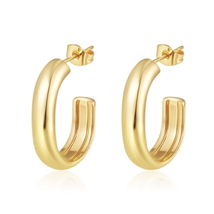 Macro shot of 18K gold-plated geometric chunky C-hoop earrings with high-polish metal finish