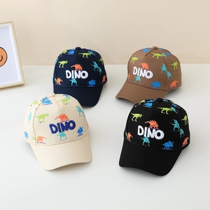 Detail of colorful dinosaur print kids baseball caps with DINO embroidery in multiple colors