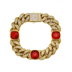 Bracelet gourmette doré de luxe avec de grandes pierres rouges et des strass étincelants