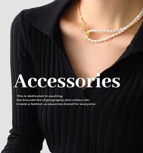 Detail of freshwater pearl and 18k gold plated titanium steel necklace on a model