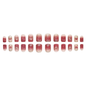 Set of 24 gradient peach press-on nails with gold leaf accents and a square-oval shape