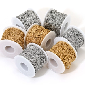 Gold and silver 18k plated stainless steel cross chains on white plastic spools for DIY