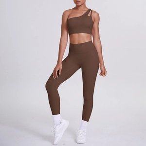 Detailed view of brown one-shoulder sports bra and high-waist leggings yoga set