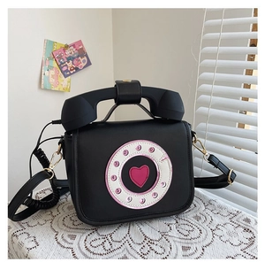 Creative vintage telephone shaped crossbody bag in black PU leather with pink heart.