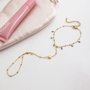 Detail of 18K gold stainless steel heart barefoot sandal with blue turquoise beads
