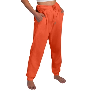 Detail of bright orange drawstring jogger pants with side pockets and elastic ankle cuffs