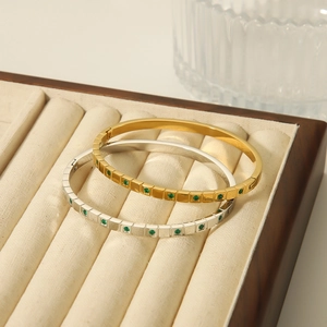 Elegant gold and silver stainless steel bangles with green emerald cubic zirconia inlay