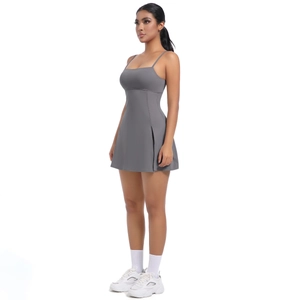 Detail view of the gray athletic dress showing the side slit design and stretch fabric