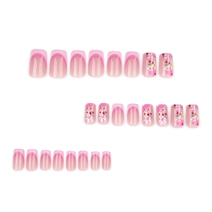 French tip press-on nails set with pink gradient and hand-painted floral designs