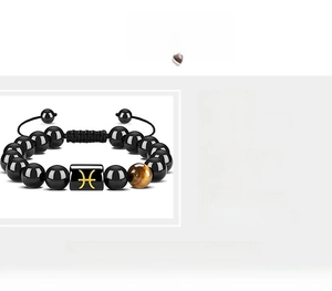 Macro shot of Pisces zodiac charm on obsidian and tiger eye stone bead bracelet