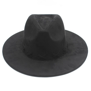 Detailed close-up of decorative cross stitching on black wide brim fedora hat crown