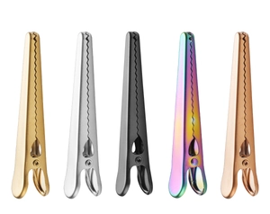 Row of colorful stainless steel hair clips with serrated teeth for hair sectioning