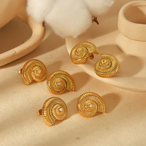 Chic 18k gold plated conch shell earrings with pearl inlay on a minimalist background