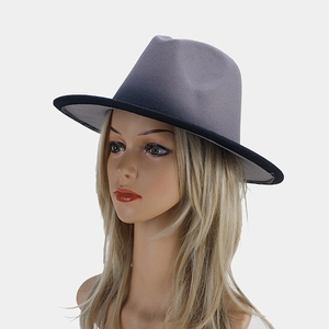 Side view of elegant gradient grey fedora hat with flat brim on a display model