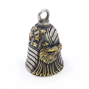 Vintage silver and gold eagle bell keychain featuring American flag relief details