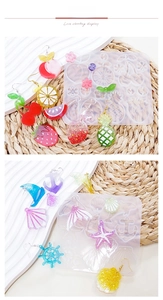 Silicone molds for resin earrings featuring fruit and ocean themes with finished samples