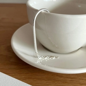 Minimalist 925 sterling silver heavy snake bone chain bracelet with extension on ceramic cup