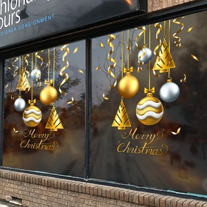 Golden Christmas bauble window decals with Merry Christmas lettering for festive shop decor