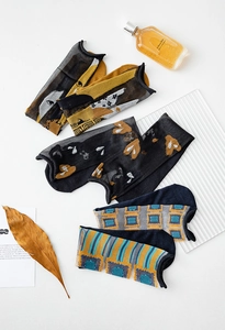 Detailed view of artistic mesh socks featuring retro oil painting prints and patterns