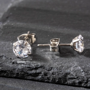 Detailed view of 6mm round cubic zirconia stud earrings with a 4-prong stainless steel setting