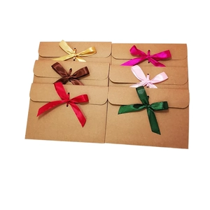 European kraft paper envelope gift bags with colorful silk ribbon bows for cards