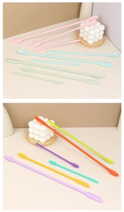 Macro detail of double-ended silicone spatulas and scoops in vibrant assorted colors
