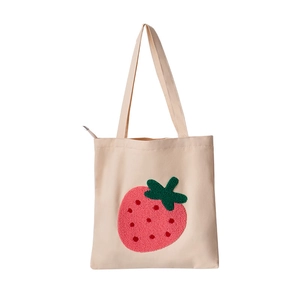 Cute beige canvas tote bag featuring embroidered strawberry pattern and zipper closure