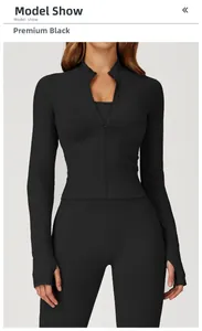 Detail of black slim-fit yoga jacket with stand collar and functional thumb holes