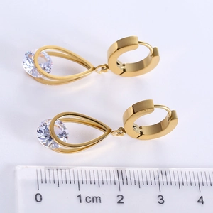 Gold stainless steel hollow teardrop earrings with zircon, size shown next to a ruler