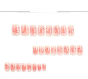 Detailed view of pink press-on nails with red and purple fireworks pattern on 24 pieces