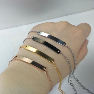 Stack of minimalist stainless steel bar bracelets in silver black gold and rose gold colors