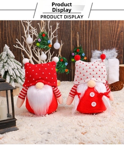 Detail of Christmas gnomes with knitted hats and white beards on snow background