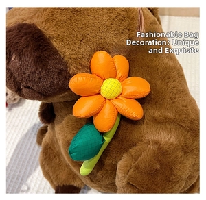 Close-up of a colorful plush flower charm attached to a brown capybara backpack