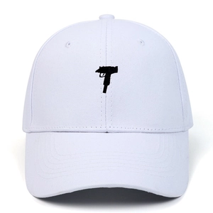 White cotton baseball cap featuring black Uzi submachine gun embroidery on the front