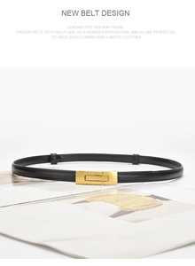 Close-up of slim black leather belt with rectangular gold buckle on fashion magazine
