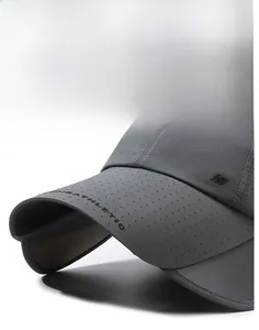 Macro detail of breathable quick-dry fabric and athletic text on sturdy curved sun hat brim