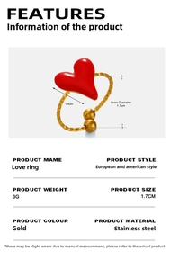 Detail of gold-plated stainless steel heart ring with red enamel and textured wavy band
