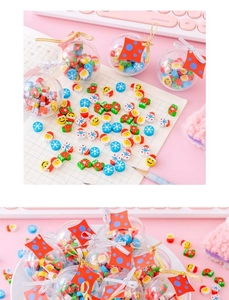 Close-up of Christmas themed mini erasers in clear spheres featuring Santa and snowmen