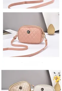 Detail of quilted cross-body bag featuring a metal rose clasp and dual zipper design