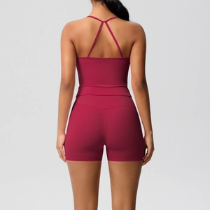 Rear view of burgundy yoga set with cross-back sports bra and slim-fit high waist shorts