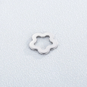 Close-up of a silver plum blossom steel pendant with a hollow center for DIY jewelry
