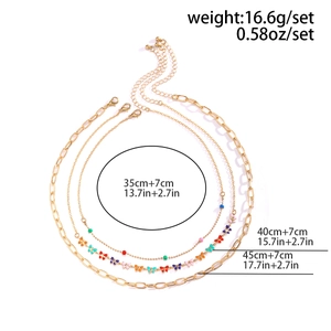 Three-layer layered necklace detail with 35/40/45cm length and 7cm extension measurements