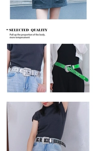 Macro detail of rhinestone-studded belts in silver, green, and black for punk denim styles