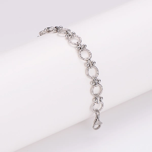 Modern silver stainless steel punk bracelet with textured rings and lobster clasp