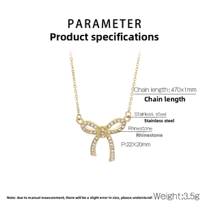 Detail view of gold bow pendant necklace with dimensions 22x20mm and sparkling rhinestones