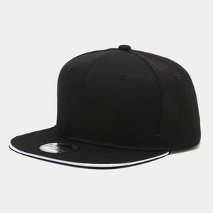 Detail view of black snapback hat showing white sandwich brim and silver sport sticker