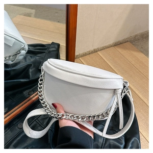 Detailed close-up of white lychee texture crescent bag with chunky silver chain