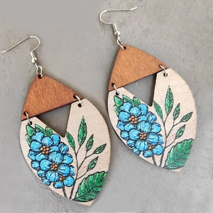 Bohemian wooden leaf earrings with painted blue flowers and green leaves on wood