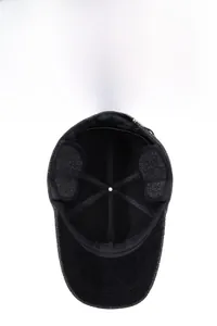 Detail view of winter baseball cap featuring warm ear flaps and thick fleece lining