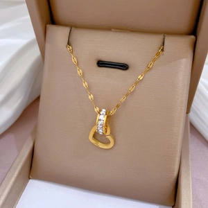 Golden heart ring necklace with Love engraving and zircon stones in a gift box